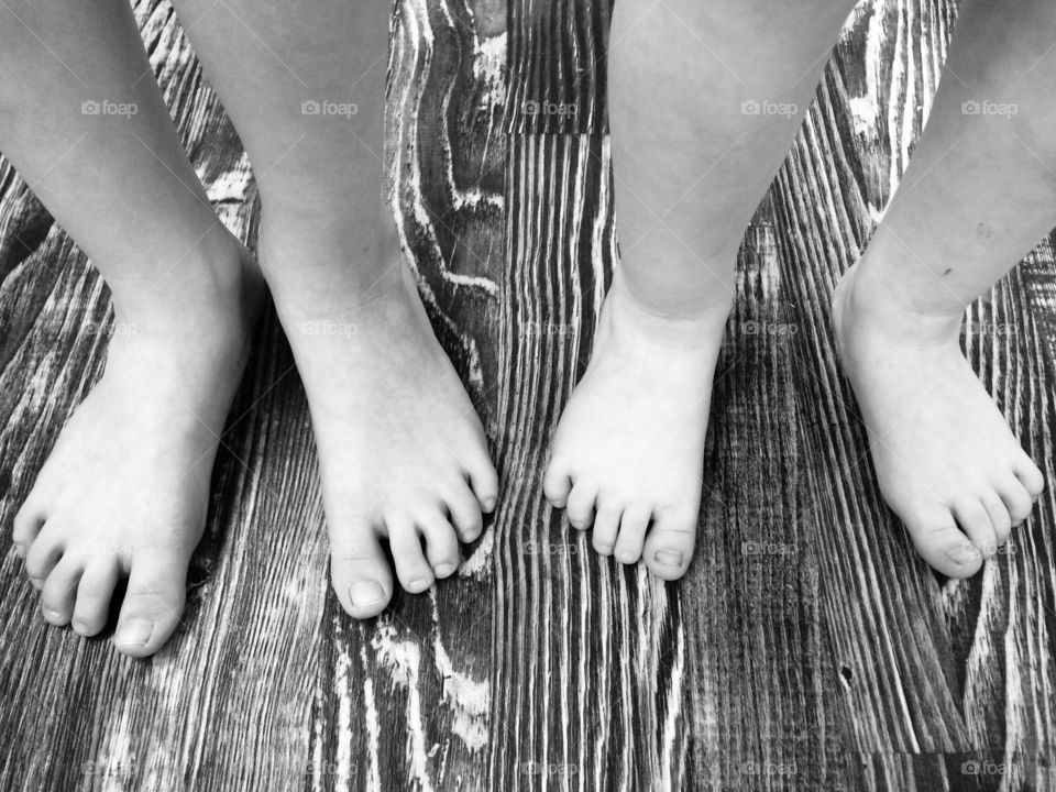 children's  feet on the floor 