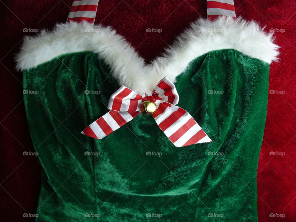 christmas sexy elf outfit with white fluffy bust decoration and large striped ribbon bow with jingle bell - dark green velvet dress - festive lingerie stripey red halter neck top velour