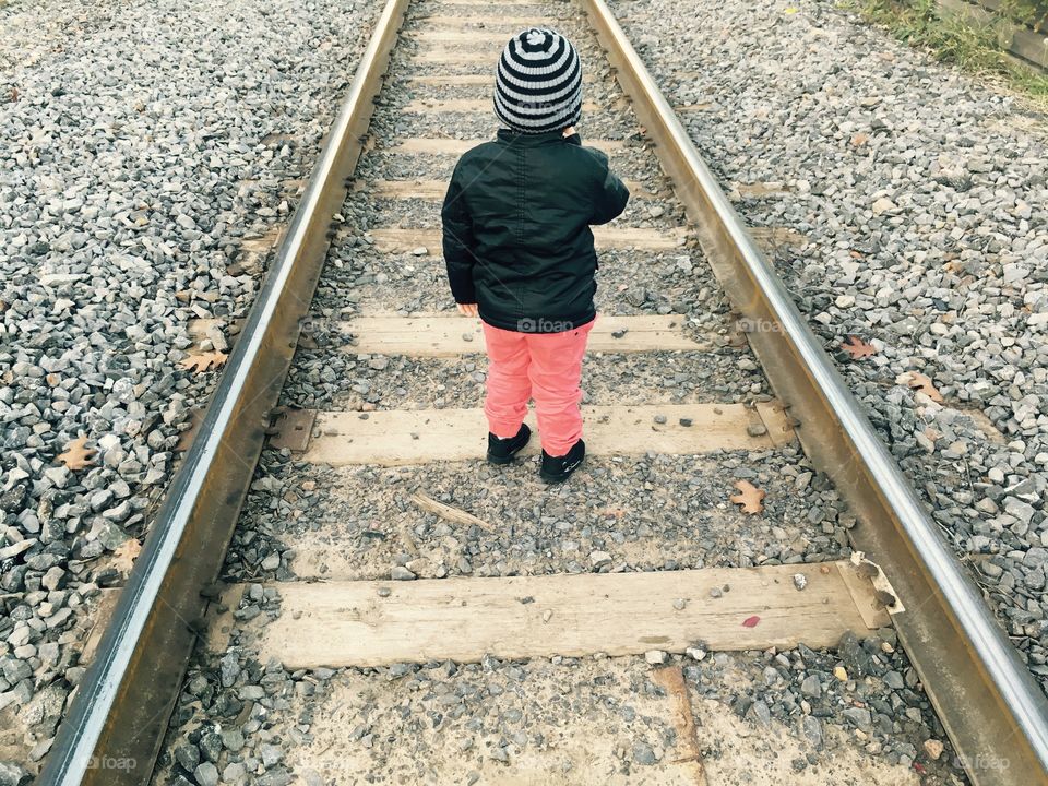 Kid and train tracks 
