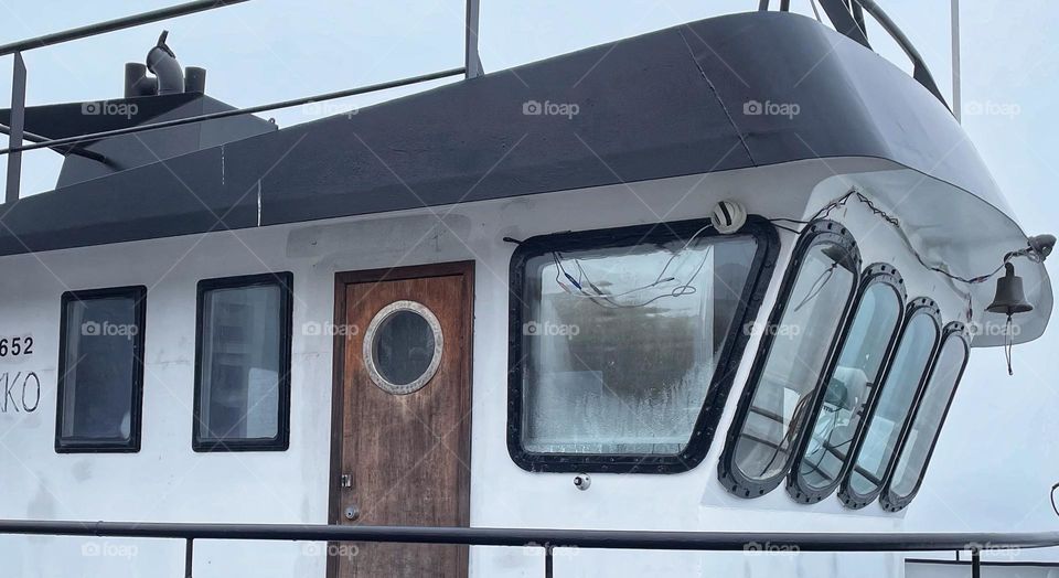 The rectangle windows of the ship's cockpit.