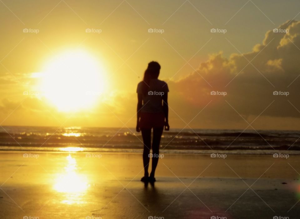 Silhouette at dawn on the beach