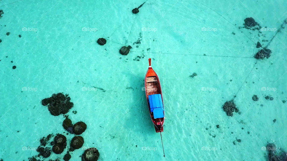 Stunning turquoise sea and boats at Lipe Island in Thailand , aerial view
