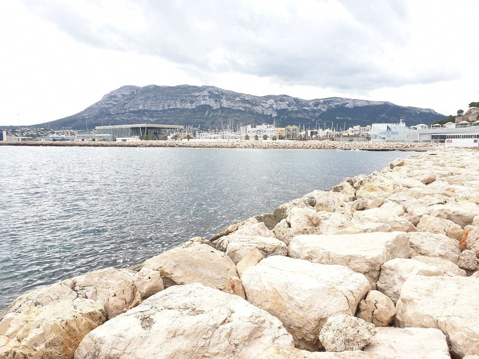 Port#sea#stone#town#mountains#sky#clouds