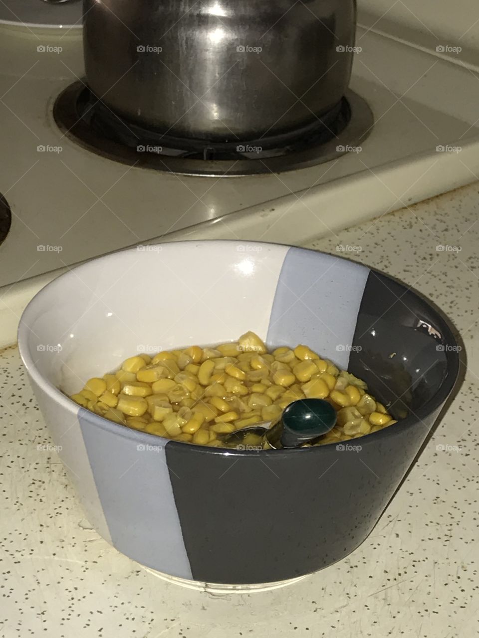 A bowl of corn kernels.