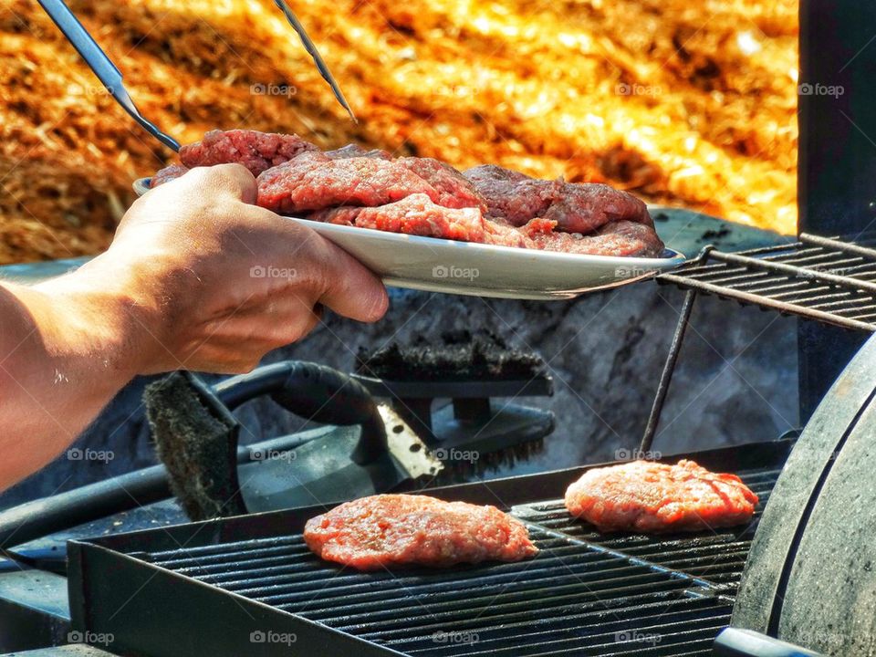 Cooking Meat Outdoors In Summer
