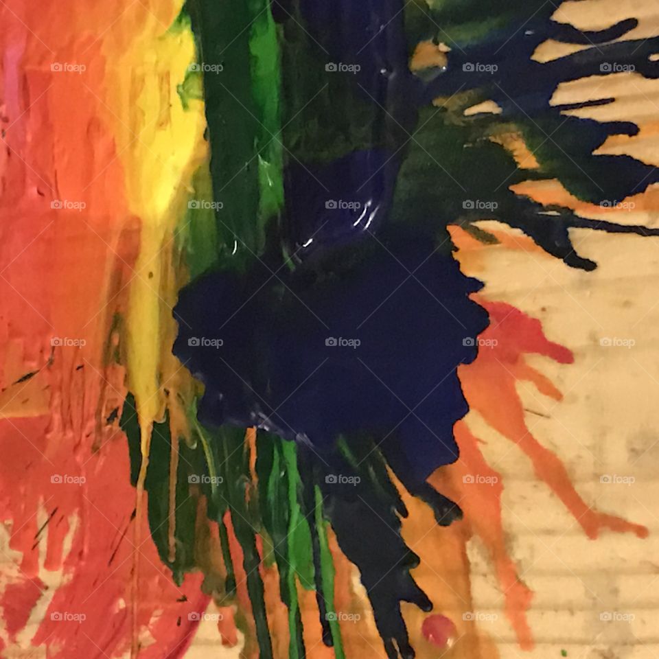 Melting crayons with a hair dryer creates an abstract art painting.