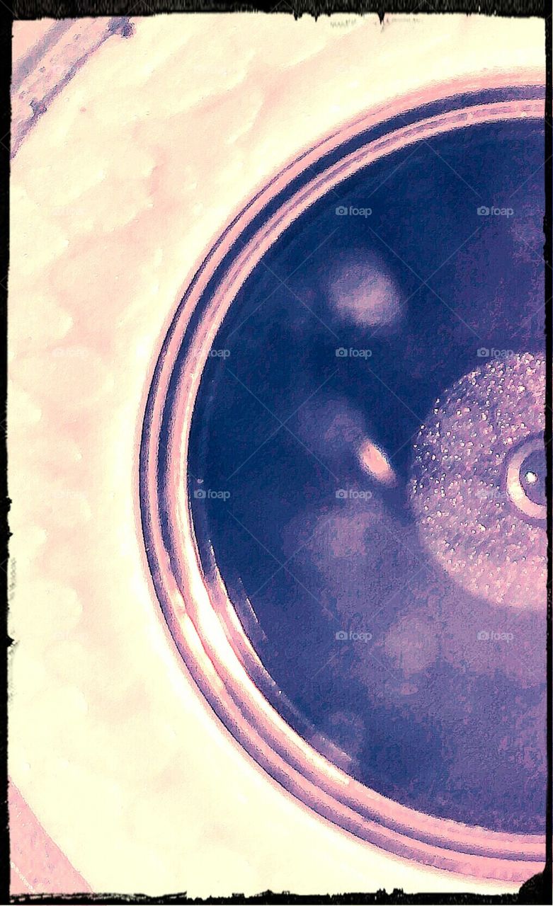 A mirror image of self captured smartphone camera lens