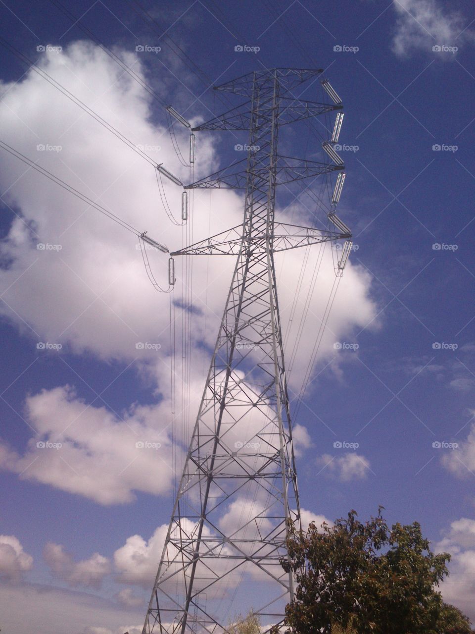 Powerline against the cloudy sky