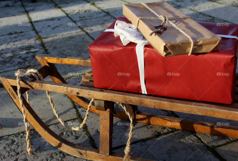 Christmas gifts on a sleigh.