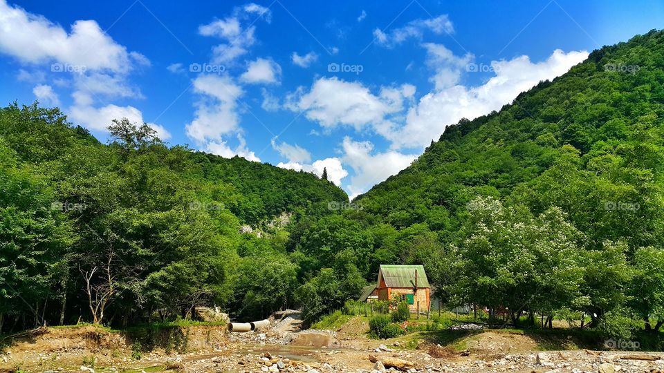 Mountaining landscape. little house in small village in Caucasian mountains