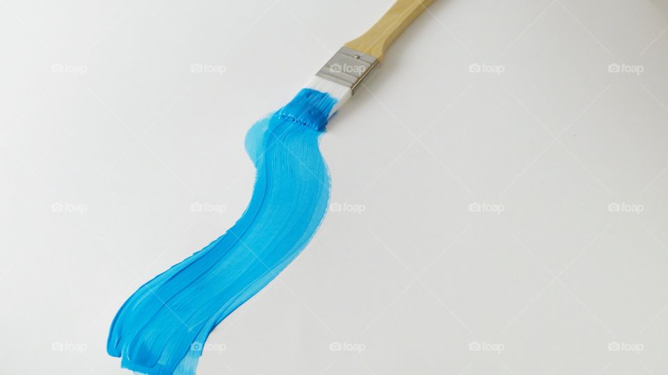 Blue color paint on paint brush