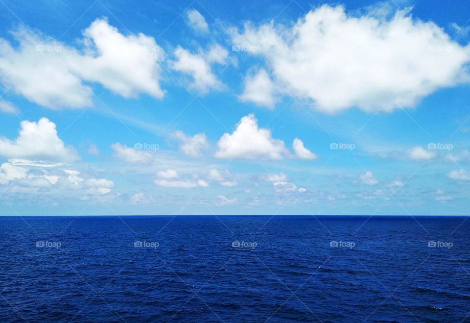 Cloudscape on the sea, the beauty of cumulus clouds combined with the softness of cirrus clouds.