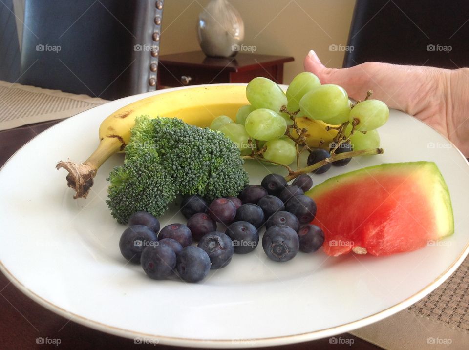 Colorful plate of fruits and vegetables that are good for you.