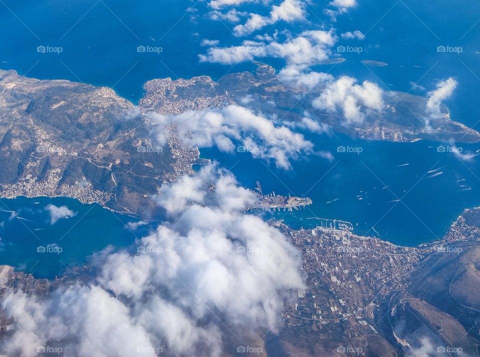 Plane view flying over the clouds in Europe