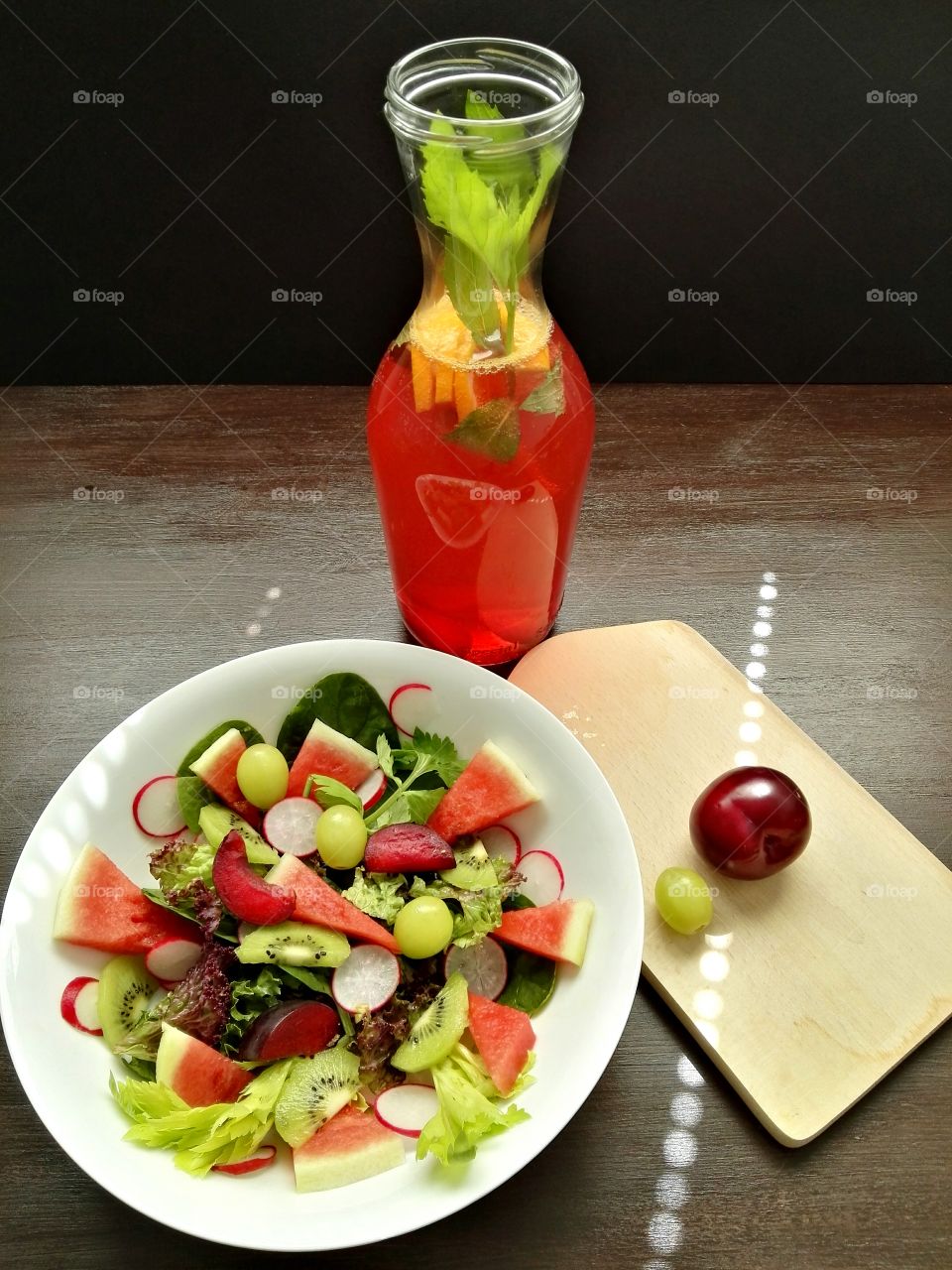 Close-up of salad and juice on table