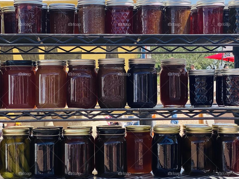 Canning goods of jam and vegetables in glass jars
