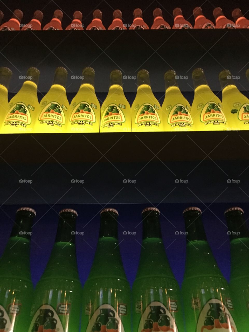 Soda bottles in colored light 