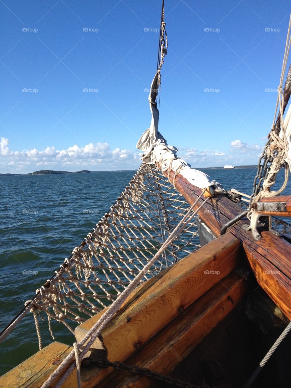 Towards the horison. A bowsprit of the sail ship and the sea.