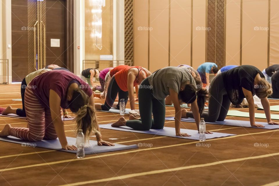 Crowd of people at the group yoga class