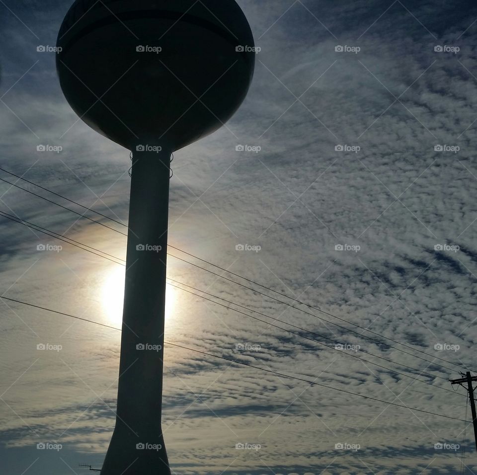 water tower eclipses the sun
