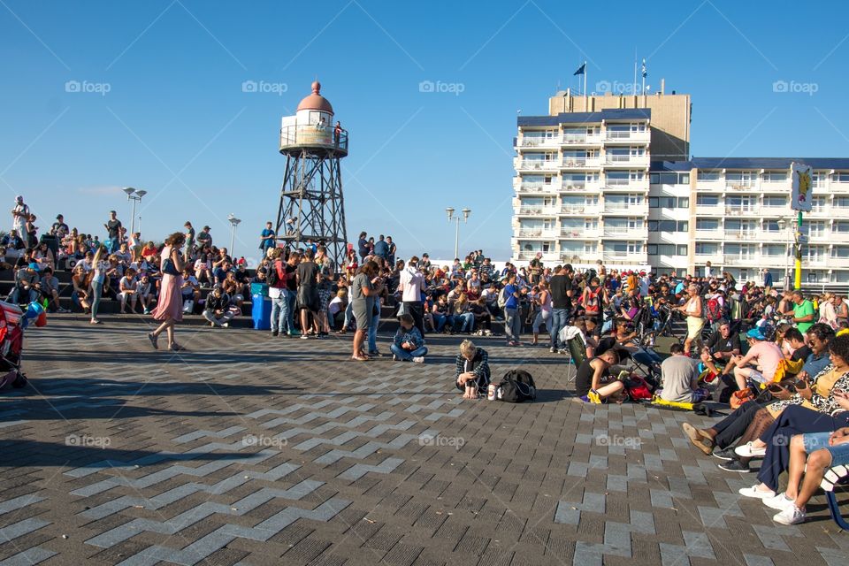 Large groups of people playing Pokémon go at the Pokémon go capitol of the Netherlands at kijkduin