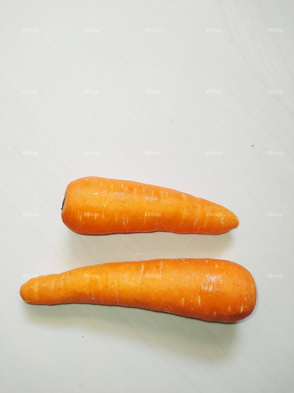 Two carrots isolated on white background