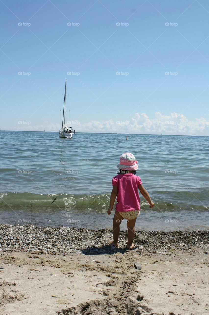 Little girl on the shore