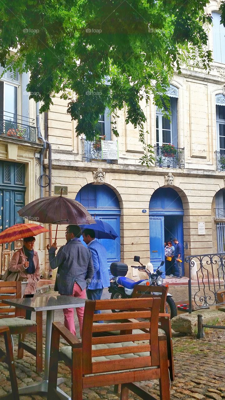 People hanging out in a rainy day in Montpellier, France