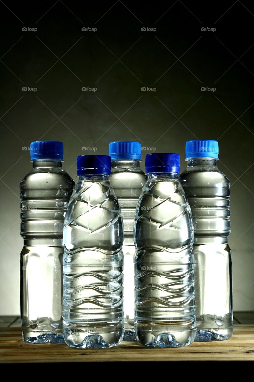 drinking water in different plastic bottles