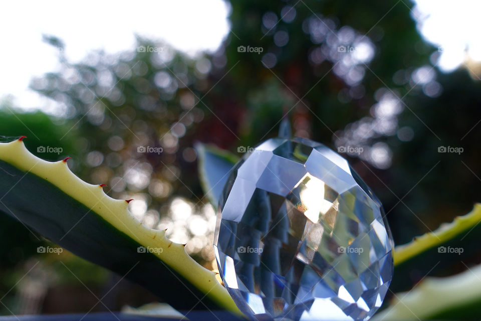 Crystal prism ball against sky during sunset 