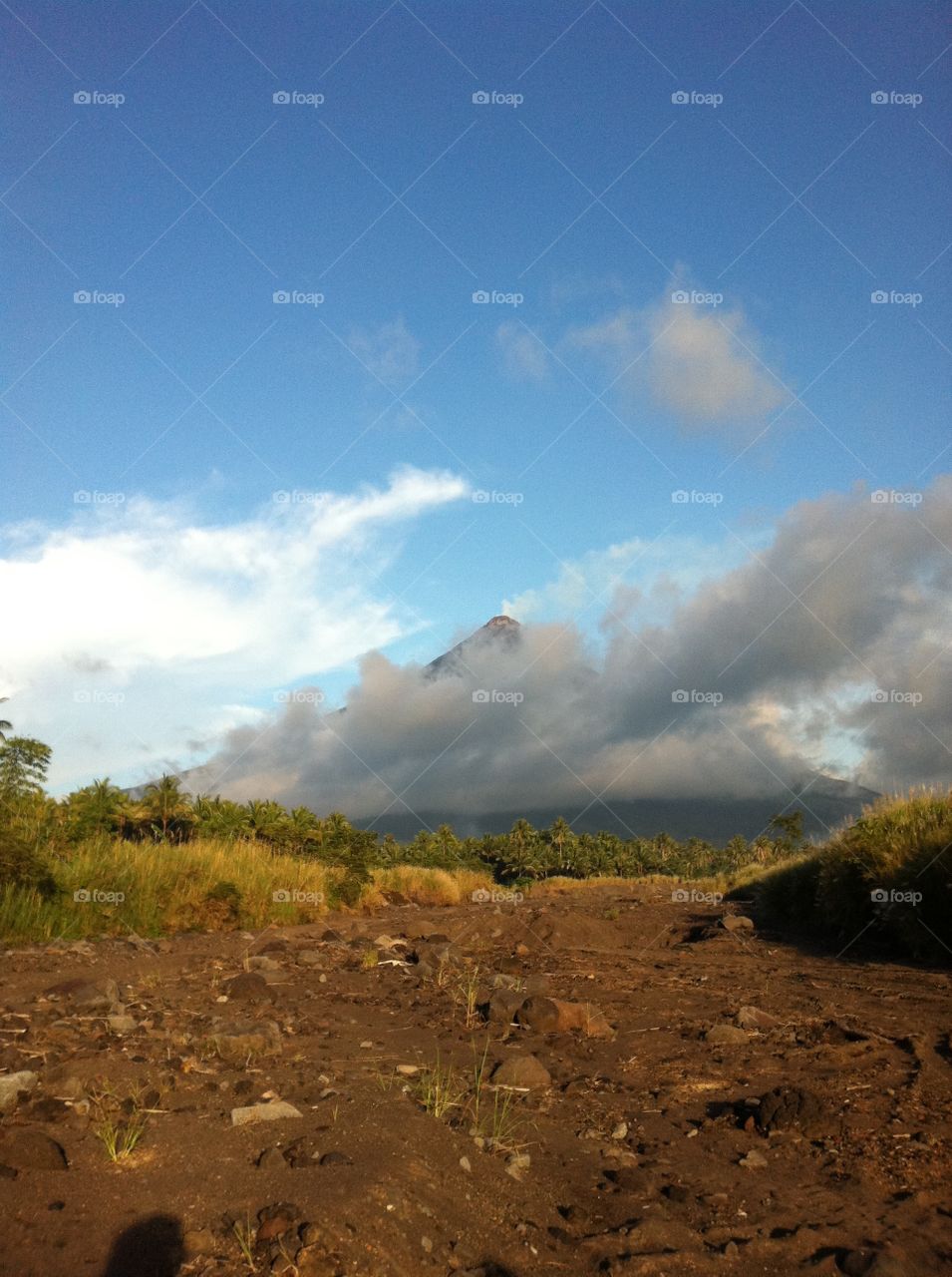 Mayon volcano hiding in a cloud cape