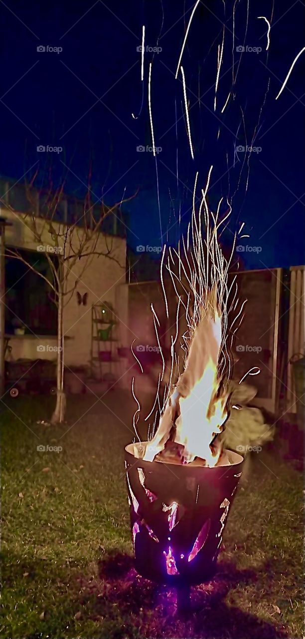 A tall fire emerges from an ornamental stainless steel handcrafted fire basket also in celebration of the new year to come, which is 2023. All this took place before, during & after the fireworks. Hypnotic Productions