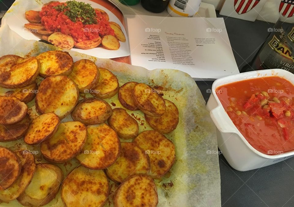 Italian cooking Tuscan potatoes following a recipe 