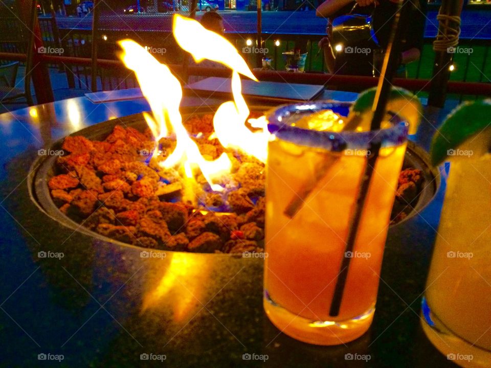 Cocktail on front of a fire