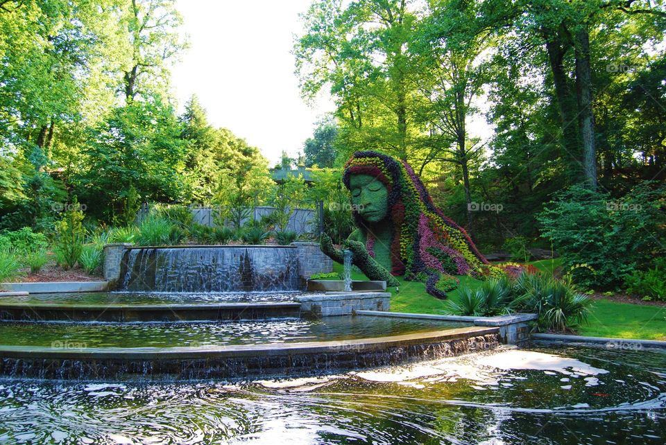 Fountain and floral lady