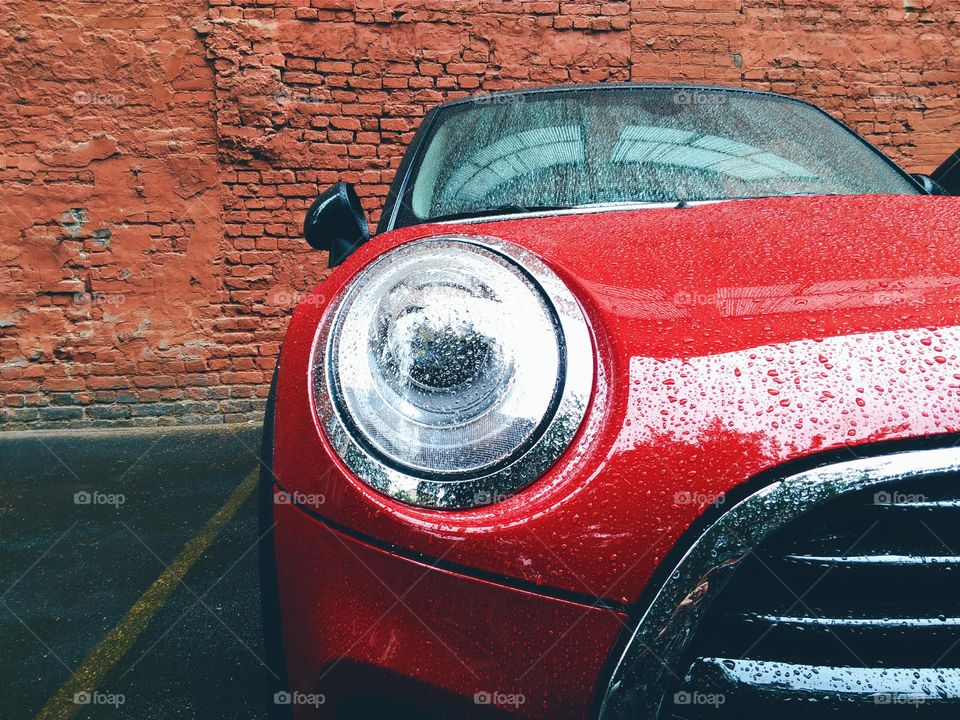 english red car mini on the background wall