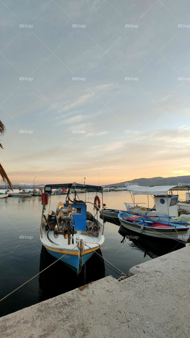 The sky is putting on a show! The boats just need a bit of rest before sailing away.