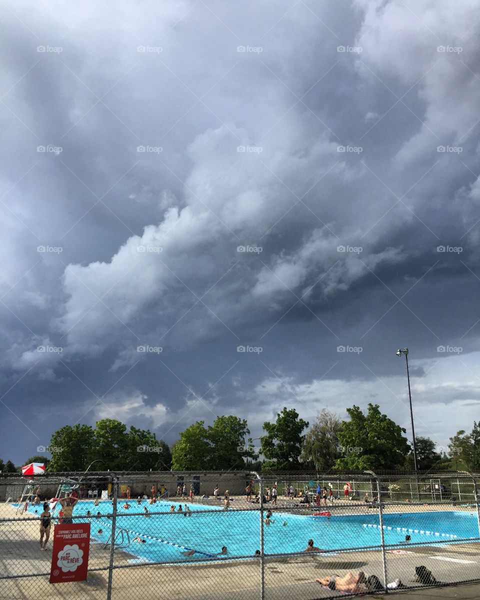 Summer storm brewing over Jarry Park pool in Montreal.