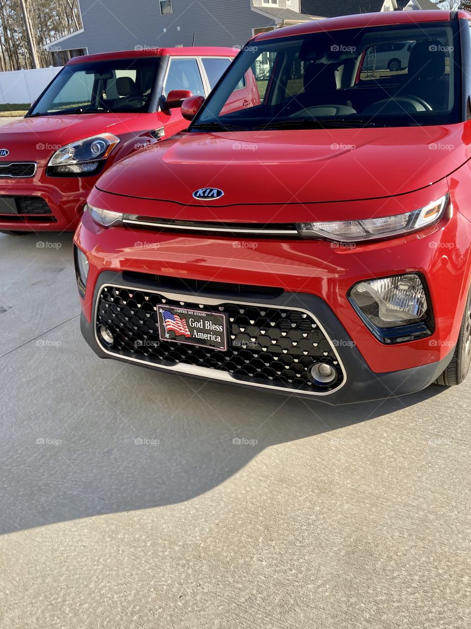 2012 and 2021 Red Kia Soul car