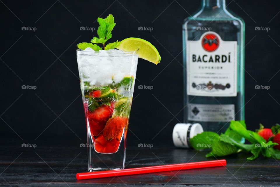 Strawberry mojito garnished with mint and a lime wedge