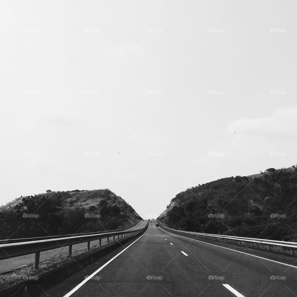 Long and winding road. Just keep moving and eventually you'll get there. Photo taken on the way to Subic, PH.