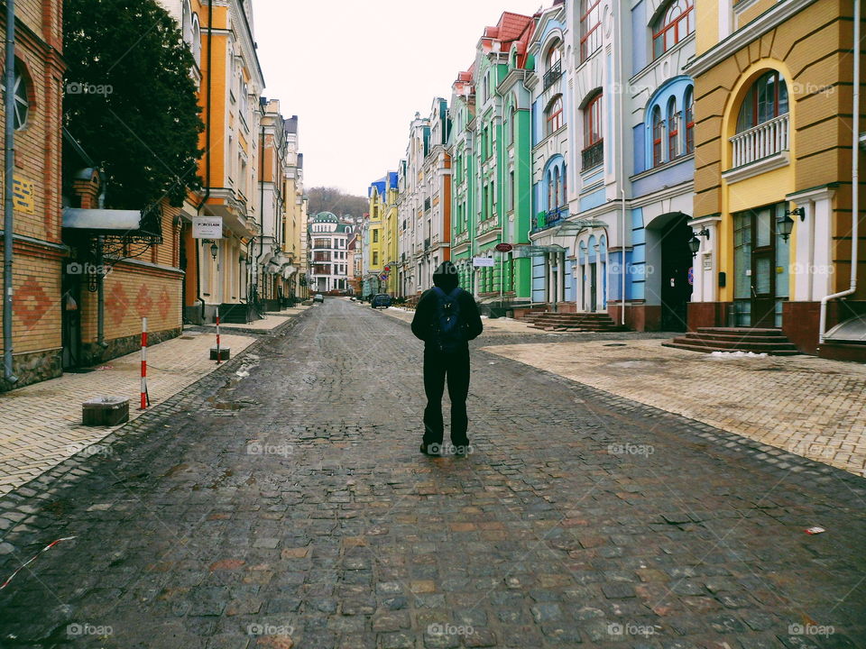 man stands on the empty street in the city of Kiev, Ukraine