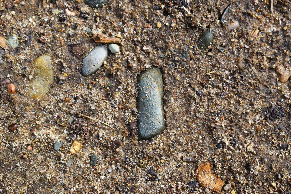 Tiny grains of sand, dirt, and rocks