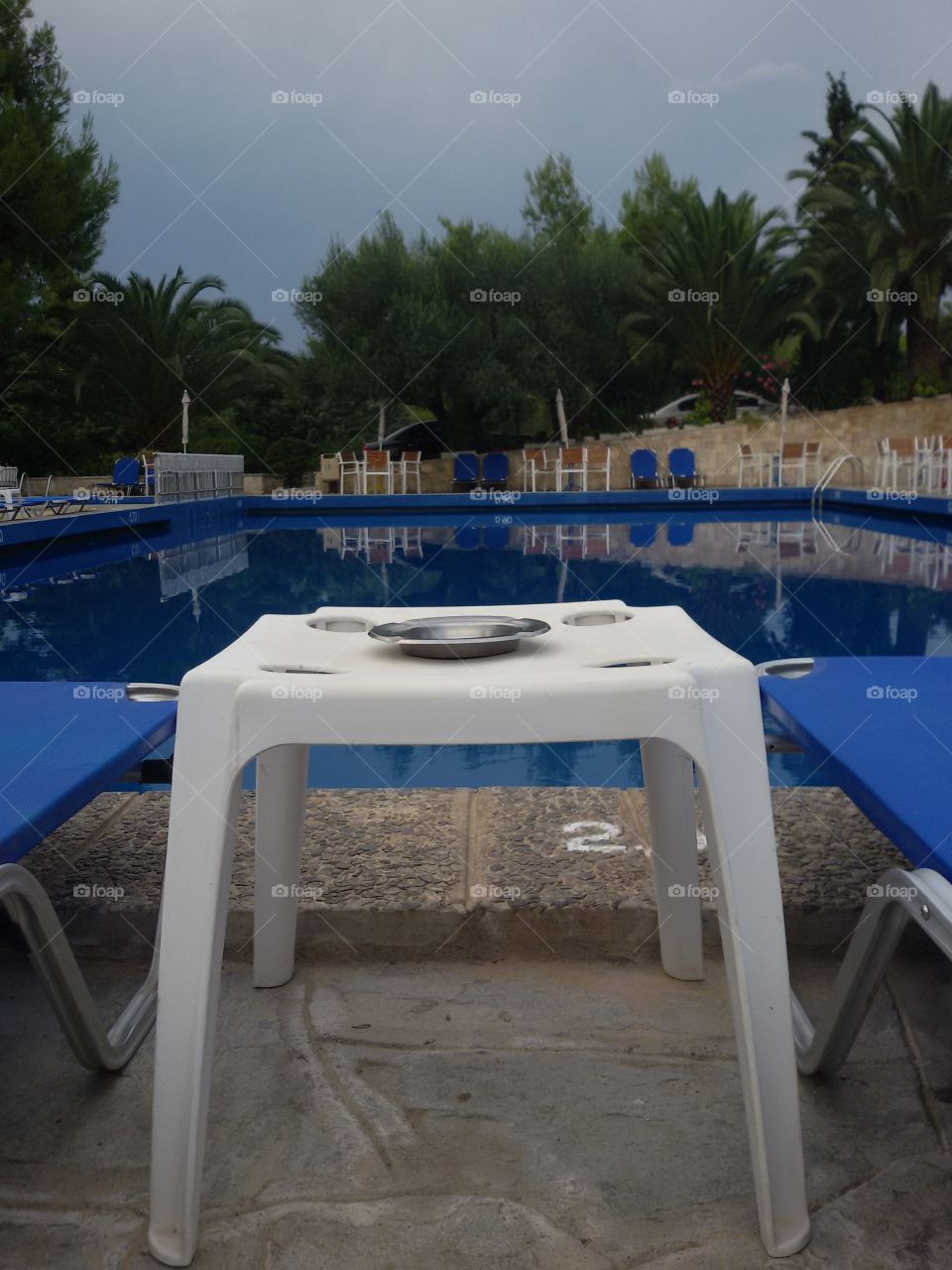 Small table near swimming pool