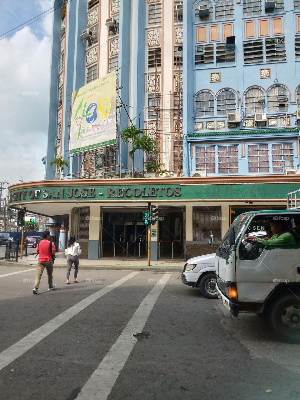 LOOK HOW POLITE THE TWO INDIVIDUALS CROSSING THE STREET ON GREEN WALK SIGNAL, THE VEHICLES ARE ALSO NOT STEPPING THE WHITE LINES,, WE NEED PEOPLE LIKE THIS FOR BETTER DISCIPLINE AND LAW ABIDING CITIZENS