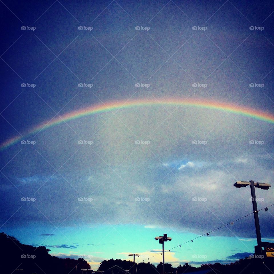 Rainbow over train station