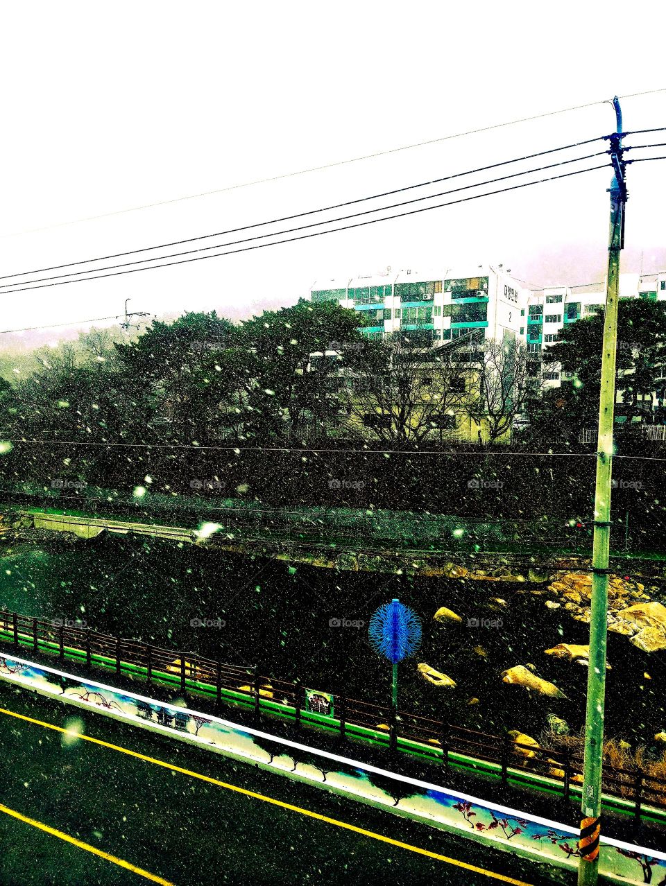 taken from above on the first snow in tongdosa yangsam city , south korea.