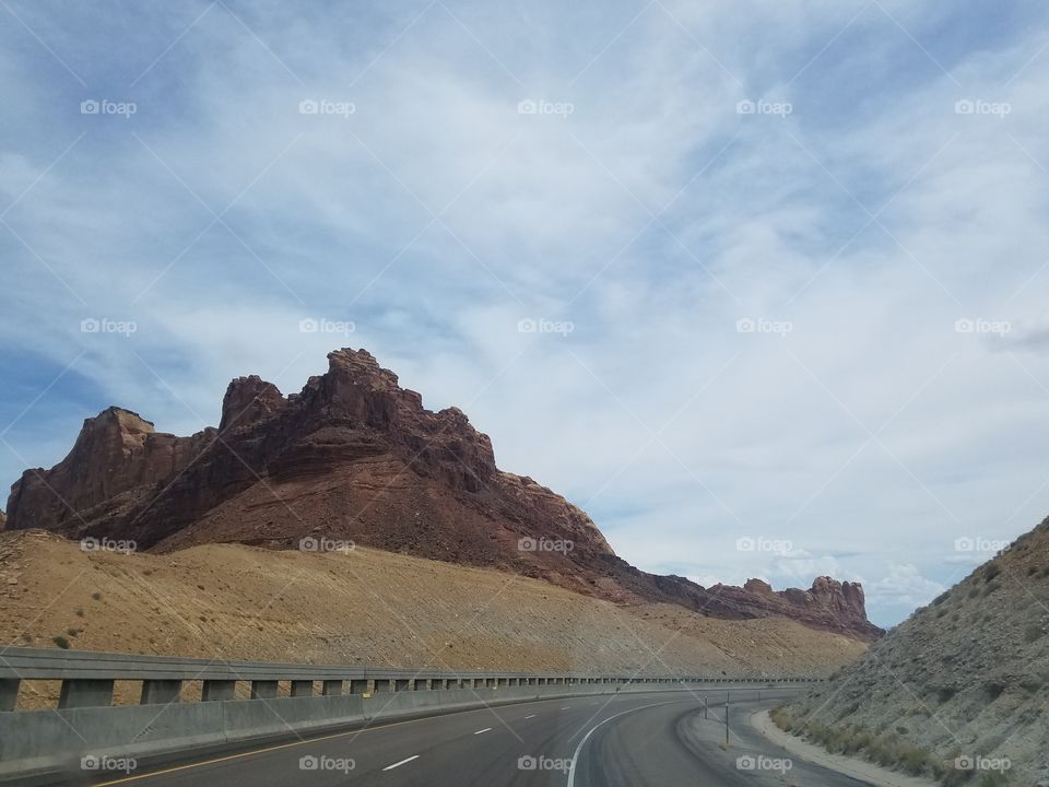 Highway through mountainous new mexico desert