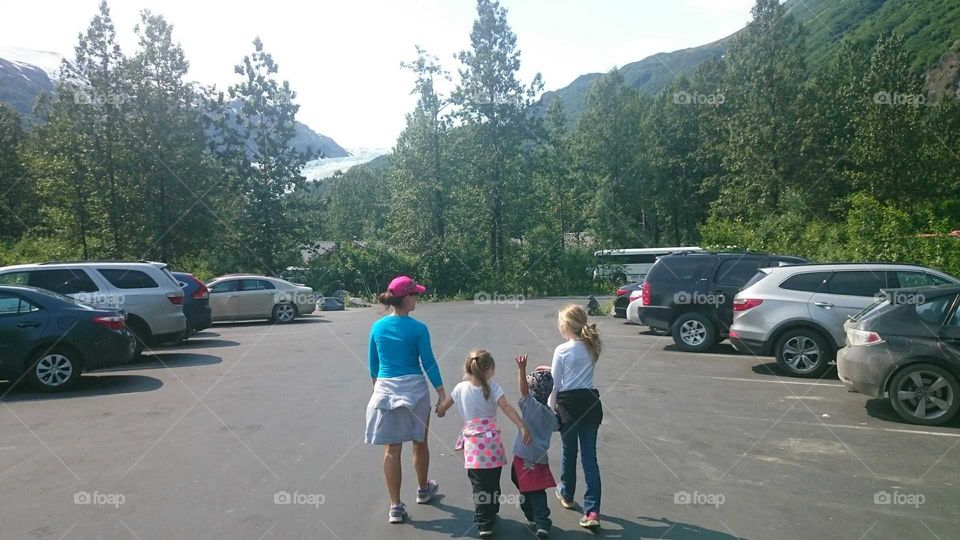 Mom and kids head up to Exit Glacier near Seward, Alaska.