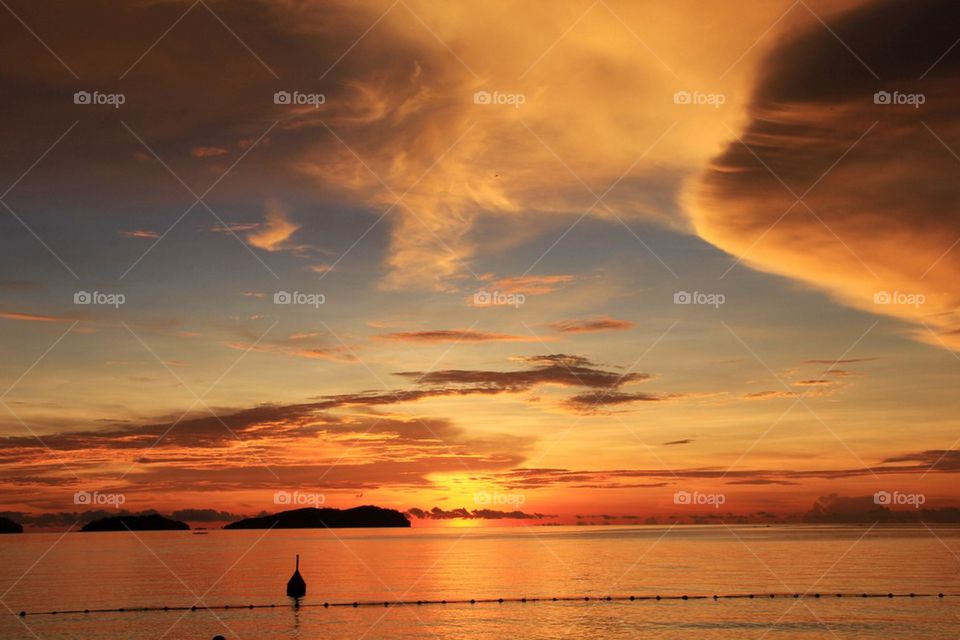 View of calm sea at sunset